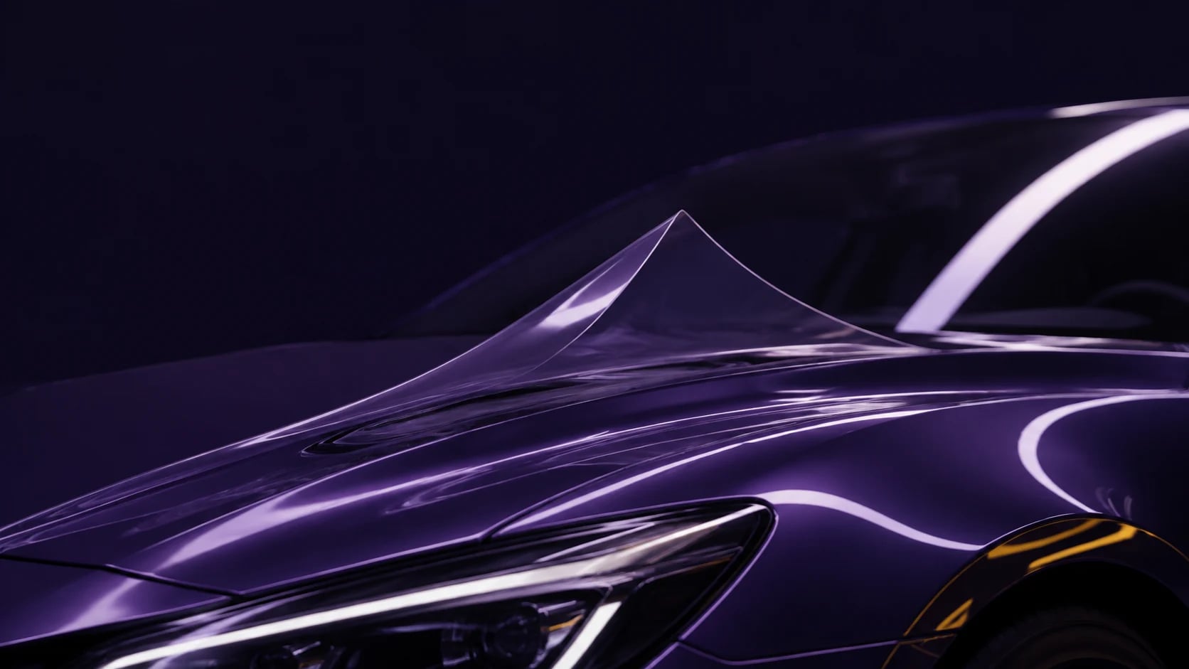 Transparent protective film lifting from the sculpted hood of an unbranded purple car, revealing the paint beneath.
